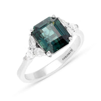 3.92 carat Emerald cut Green Sapphire ring with 6 Pear Shape diamond side stones in a total of 0.46 carats